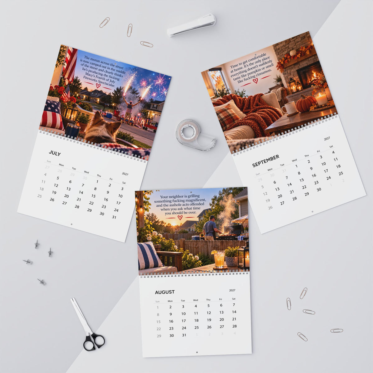 Three printed monthly calendar pages laid out on a light gray surface with office props. The pages show colorful lifestyle photos and text blocks, with July, August, and September visible.